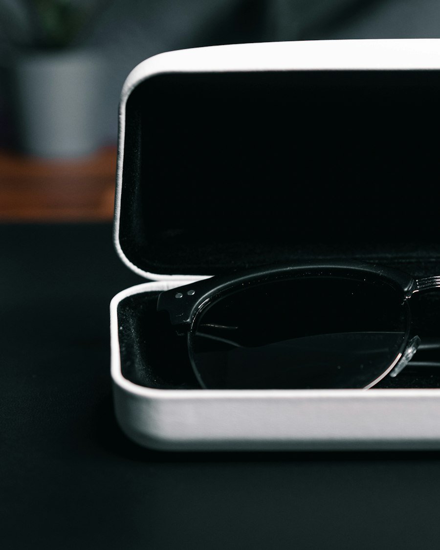 Black sunglasses in a white hard case